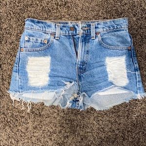 distressed Levi’s 512 shorts